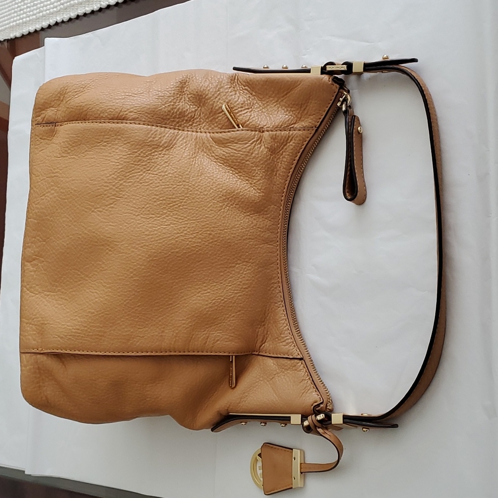 Michael Kors shoulder Bowery large peanut leather hobo bag.